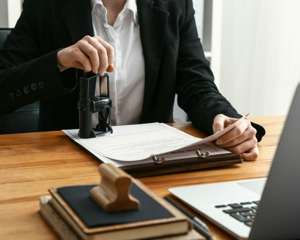 Prestige Notaries - A woman in a business suit providing notary service