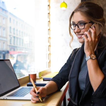 A woman is talking on a cell phone.